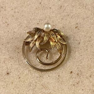 Elegant Gold and White Brooch with Nature Motif